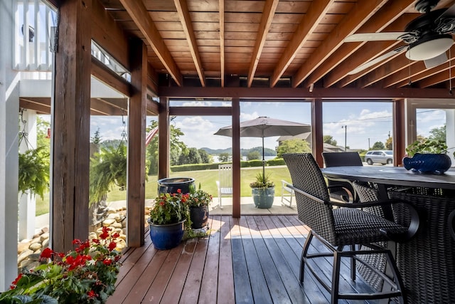 sunroom / solarium with ceiling fan and plenty of natural light