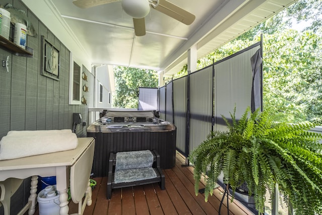 deck with central air condition unit, covered porch, and a hot tub