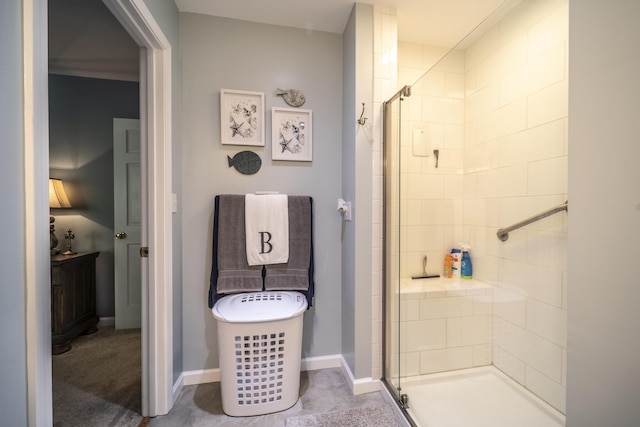 bathroom featuring a shower with shower door