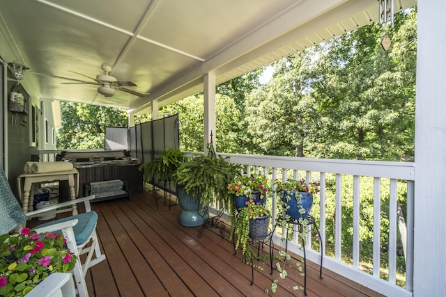 wooden deck with ceiling fan and covered porch