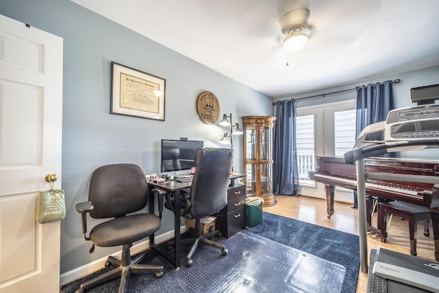 office area with ceiling fan and hardwood / wood-style flooring