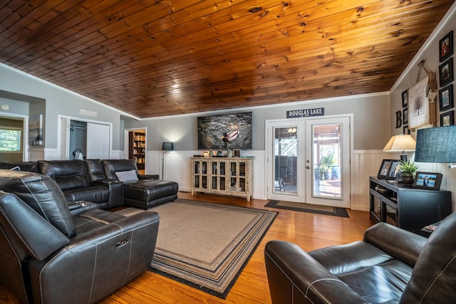 living room featuring french doors, wooden ceiling, crown molding, and lofted ceiling