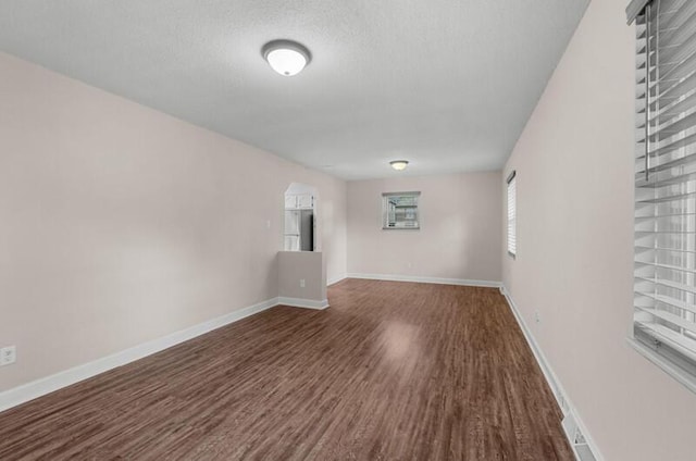 4061 Julian Ave, Morristown, TN 37814 - spare room with wood finished floors, a textured ceiling, and baseboards