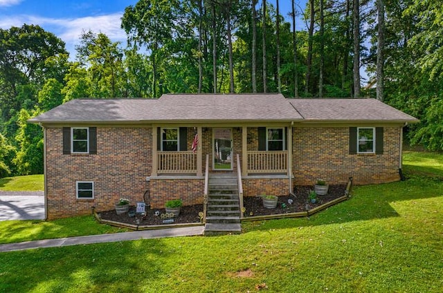 4061 Julian Ave, Morristown, TN 37814 - view of front of house featuring covered porch, brick siding, a front yard, and stairs