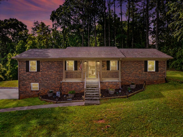 4061 Julian Ave, Morristown, TN 37814 - view of front of house featuring brick siding, a lawn, and covered porch