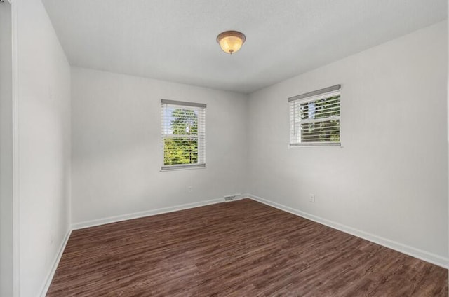 4061 Julian Ave, Morristown, TN 37814 - empty room featuring dark wood-style flooring and baseboards