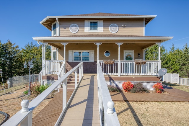 view of front of house with fence and covered porch