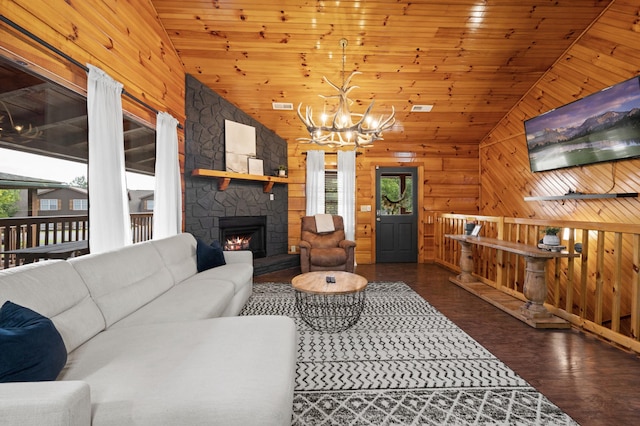 living room featuring lofted ceiling, a healthy amount of sunlight, wood ceiling, and dark hardwood / wood-style flooring