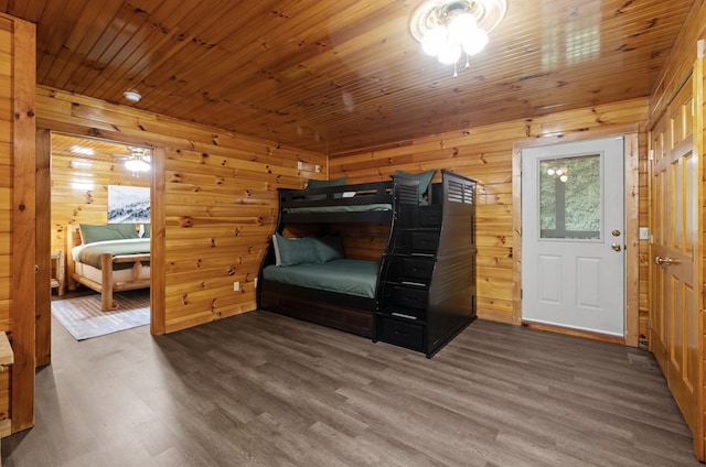 bedroom with hardwood / wood-style flooring, wooden walls, and wood ceiling