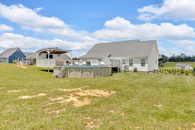 113 Cheshire Ct, Jefferson City, TN 37760 - rear view of property with a wooden deck, a lawn, an outdoor pool, and a shingled roof
