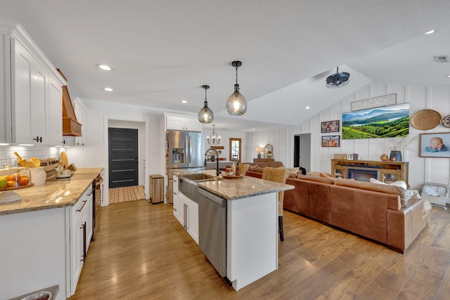 113 Cheshire Ct, Jefferson City, TN 37760 - kitchen featuring dishwasher, open floor plan, a sink, white cabinetry, and light wood finished floors