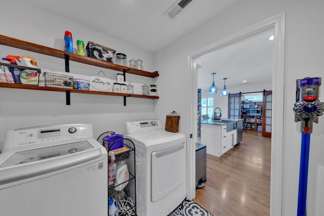 113 Cheshire Ct, Jefferson City, TN 37760 - laundry room featuring washing machine and dryer and light wood-type flooring