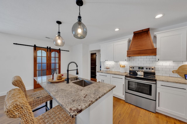113 Cheshire Ct, Jefferson City, TN 37760 - kitchen with electric stove, custom exhaust hood, a sink, a barn door, and backsplash