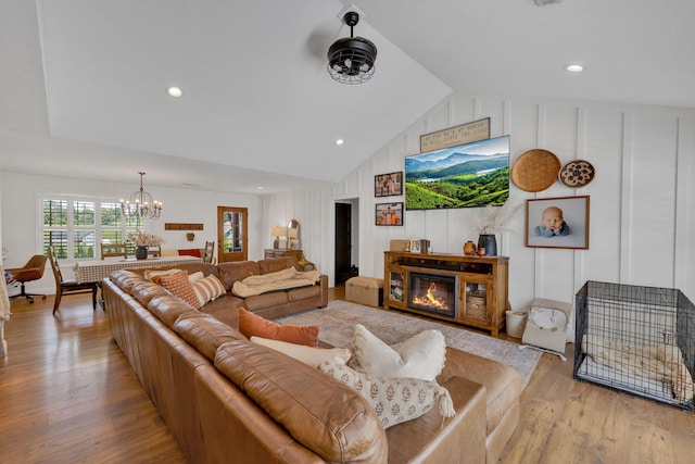 113 Cheshire Ct, Jefferson City, TN 37760 - living area with a chandelier, light wood-type flooring, vaulted ceiling, recessed lighting, and a glass covered fireplace