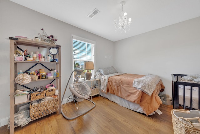 113 Cheshire Ct, Jefferson City, TN 37760 - bedroom with wood finished floors and a chandelier
