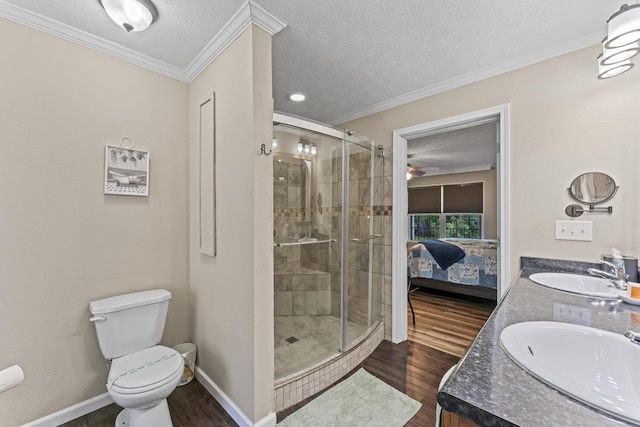 104-116 Circle Rd, Newport, TN 37821 - ensuite bathroom featuring wood finished floors, a shower stall, double vanity, crown molding, and a textured ceiling