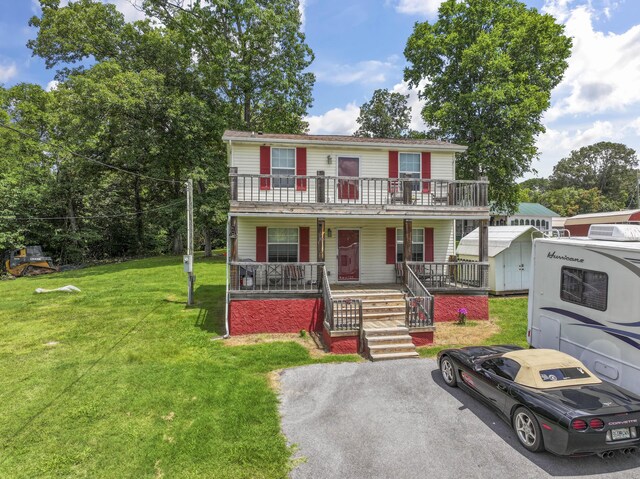 104-116 Circle Rd, Newport, TN 37821 - view of property featuring a porch, a front lawn, and stairs