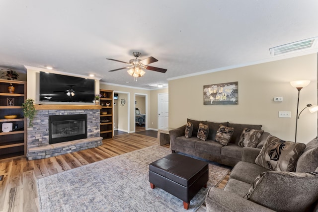 104-116 Circle Rd, Newport, TN 37821 - living room with wood finished floors, crown molding, a ceiling fan, and a fireplace