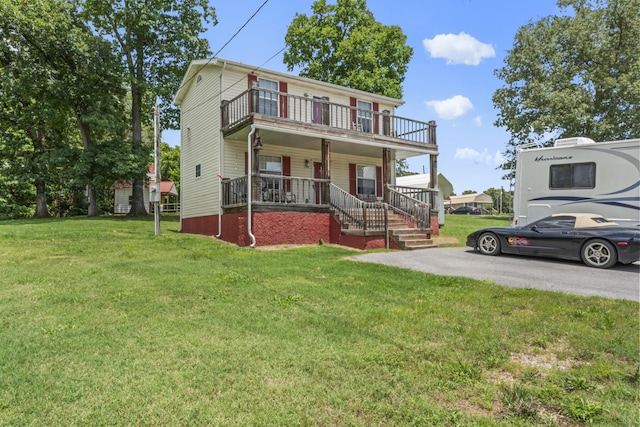 104-116 Circle Rd, Newport, TN 37821 - view of front of home with covered porch, a balcony, and a front yard
