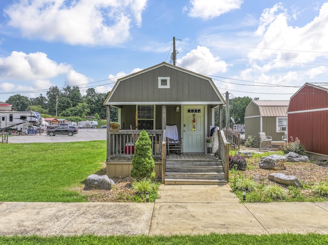 104-116 Circle Rd, Newport, TN 37821 - dutch colonial with a porch, a storage shed, and a front yard