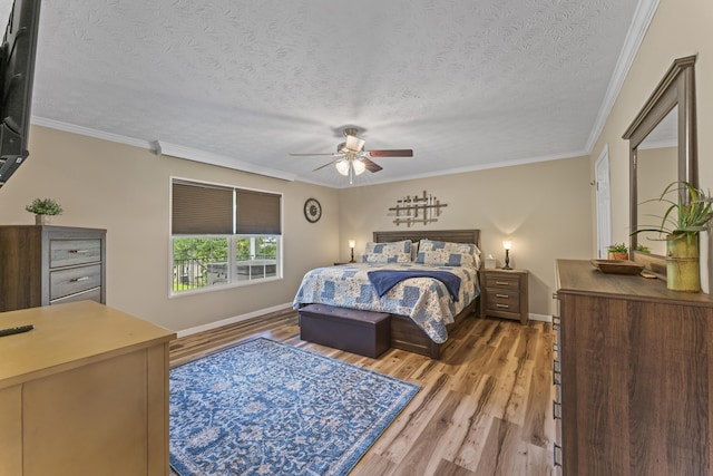 104-116 Circle Rd, Newport, TN 37821 - bedroom with light wood-type flooring, crown molding, a textured ceiling, and ceiling fan