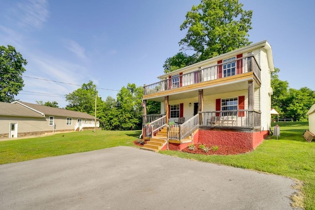 104-116 Circle Rd, Newport, TN 37821 - view of front of property featuring a porch, a balcony, and a front yard