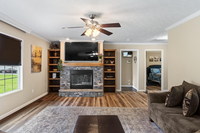 104-116 Circle Rd, Newport, TN 37821 - living room with wood finished floors, a stone fireplace, a ceiling fan, and crown molding