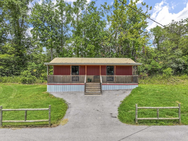 104-116 Circle Rd, Newport, TN 37821 - view of front facade with covered porch, driveway, and board and batten siding