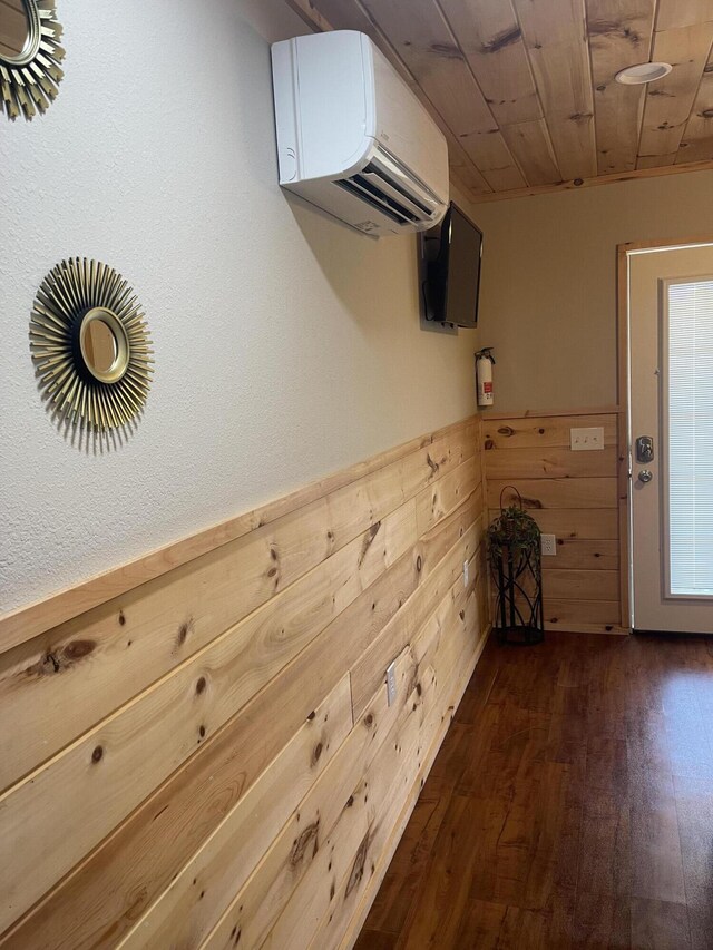 104-116 Circle Rd, Newport, TN 37821 - interior space featuring a wall unit AC, dark wood-style floors, and wood walls