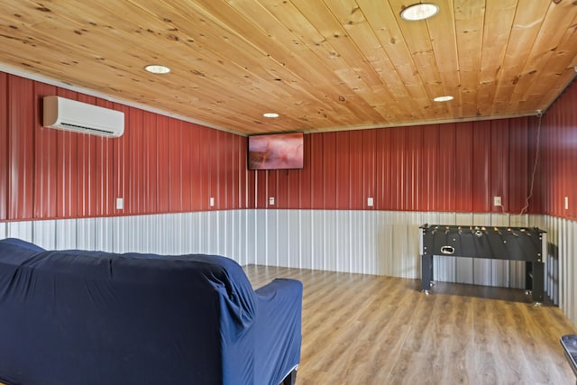 104-116 Circle Rd, Newport, TN 37821 - living room with a wall mounted AC, wood ceiling, wood finished floors, and wooden walls