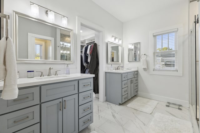 340 Back Nine Dr, Baneberry, TN 37890 - full bathroom with two vanities, baseboards, a walk in closet, and marble finish flooring