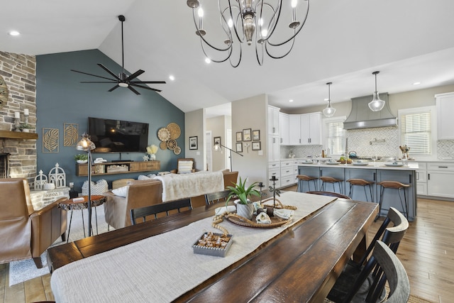 340 Back Nine Dr, Baneberry, TN 37890 - dining space featuring light wood-style floors, a ceiling fan, high vaulted ceiling, a chandelier, and recessed lighting