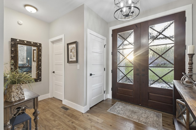 340 Back Nine Dr, Baneberry, TN 37890 - entryway with french doors, wood finished floors, baseboards, and a chandelier