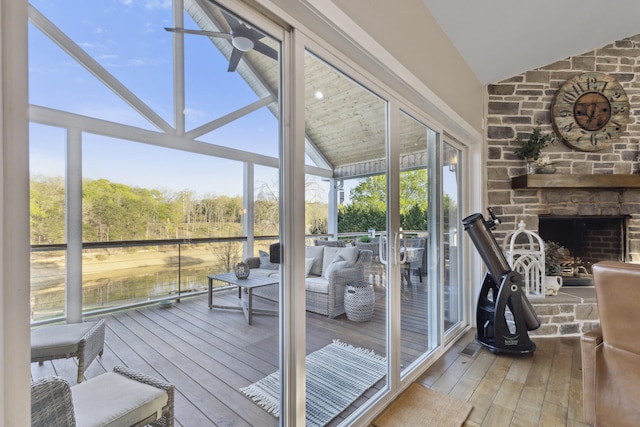 340 Back Nine Dr, Baneberry, TN 37890 - sunroom / solarium featuring wood-type flooring, high vaulted ceiling, and a stone fireplace