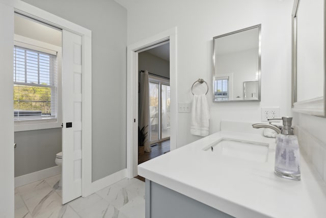 340 Back Nine Dr, Baneberry, TN 37890 - bathroom featuring marble look tiles, toilet, baseboards, and vanity