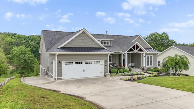 340 Back Nine Dr, Baneberry, TN 37890 - craftsman house with a standing seam roof, a front yard, concrete driveway, a garage, and a porch