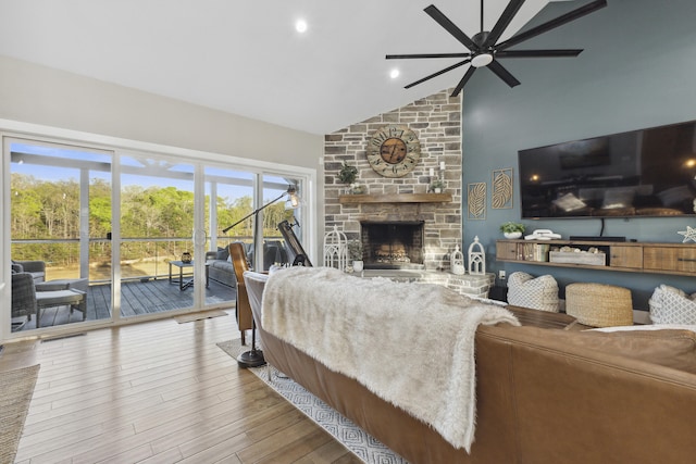 340 Back Nine Dr, Baneberry, TN 37890 - living area featuring ceiling fan, a stone fireplace, high vaulted ceiling, and wood finished floors