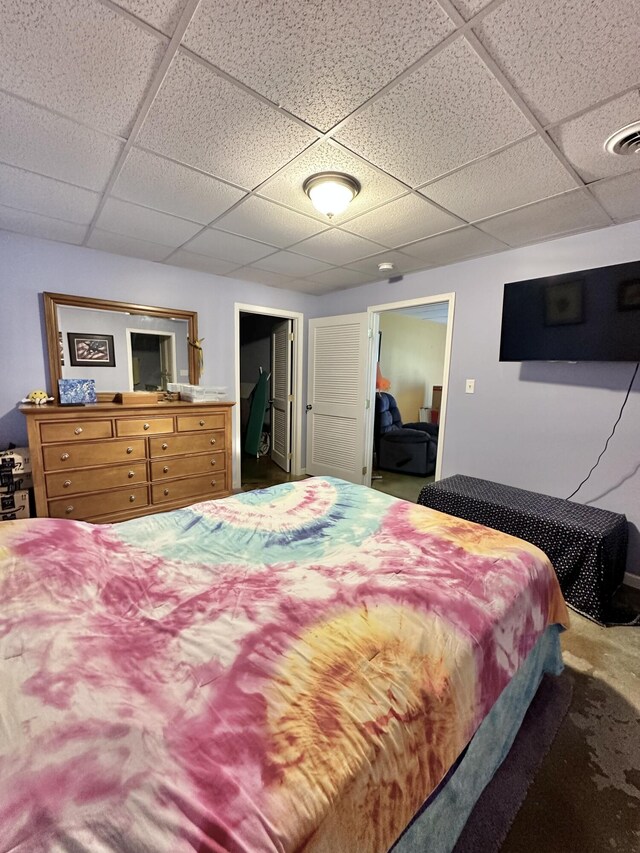 bedroom featuring a drop ceiling