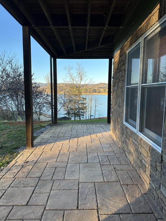 view of patio / terrace featuring a water view