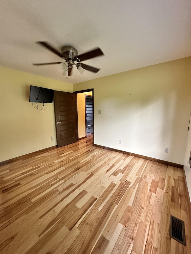 unfurnished bedroom featuring light hardwood / wood-style flooring and ceiling fan