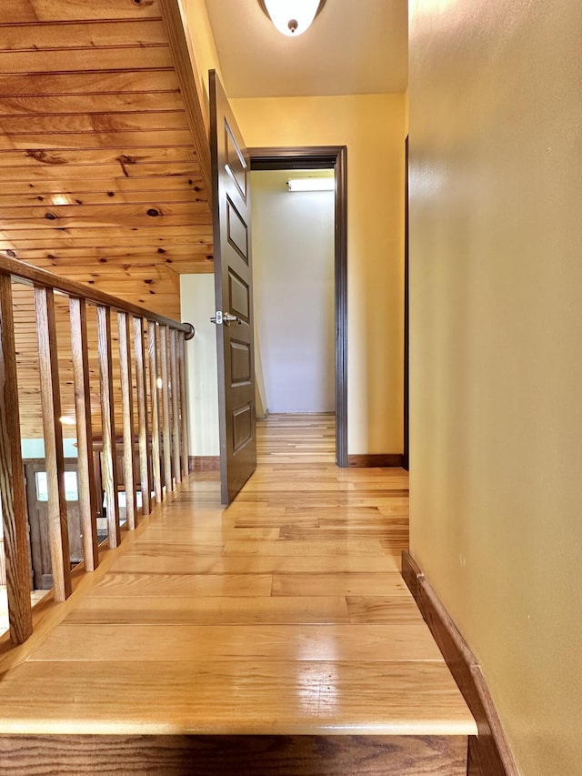 hallway with light hardwood / wood-style flooring