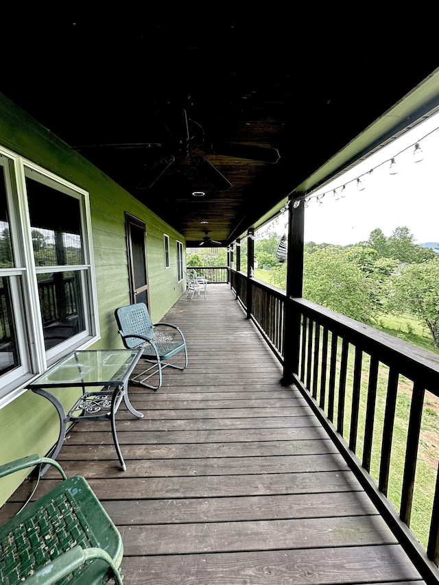 wooden terrace with ceiling fan