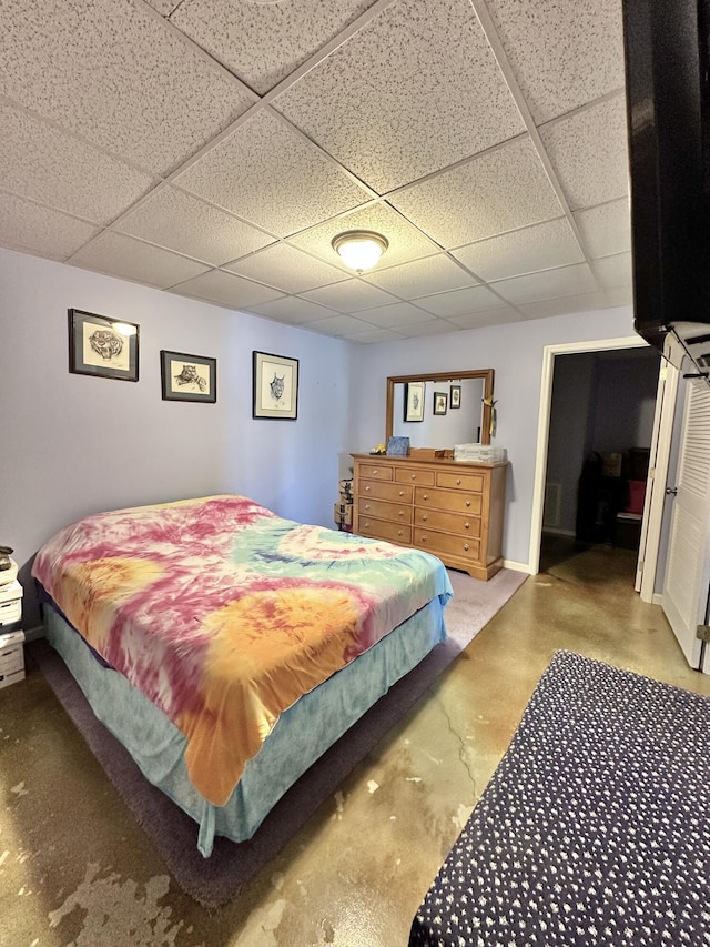 bedroom with a paneled ceiling