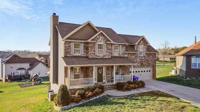9357 Gabrielle Rd, Strawberry Plains, TN 37871 - traditional-style home with a chimney, an attached garage, covered porch, concrete driveway, and a front lawn