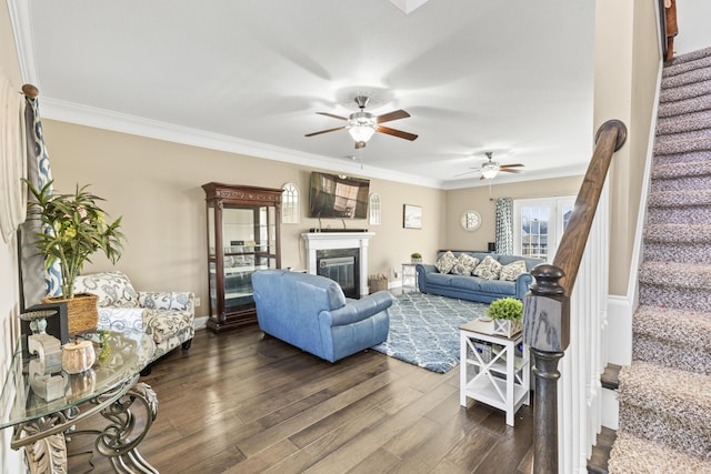 9357 Gabrielle Rd, Strawberry Plains, TN 37871 - living area with stairway, a ceiling fan, dark wood-type flooring, crown molding, and a high end fireplace