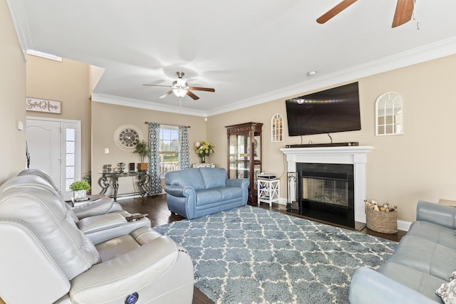 9357 Gabrielle Rd, Strawberry Plains, TN 37871 - living room featuring a ceiling fan, ornamental molding, wood finished floors, a glass covered fireplace, and baseboards