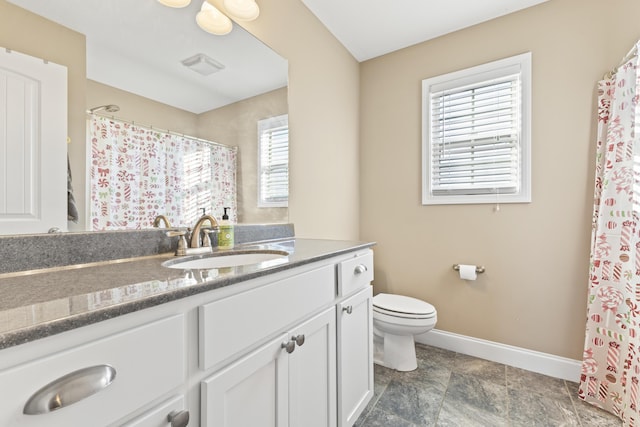 9357 Gabrielle Rd, Strawberry Plains, TN 37871 - bathroom featuring baseboards, toilet, vanity, stone finish flooring, and a shower with curtain