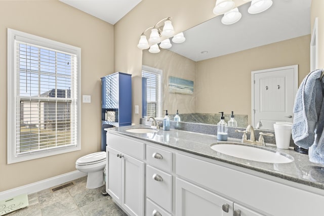 9357 Gabrielle Rd, Strawberry Plains, TN 37871 - full bath with toilet, double vanity, and baseboards