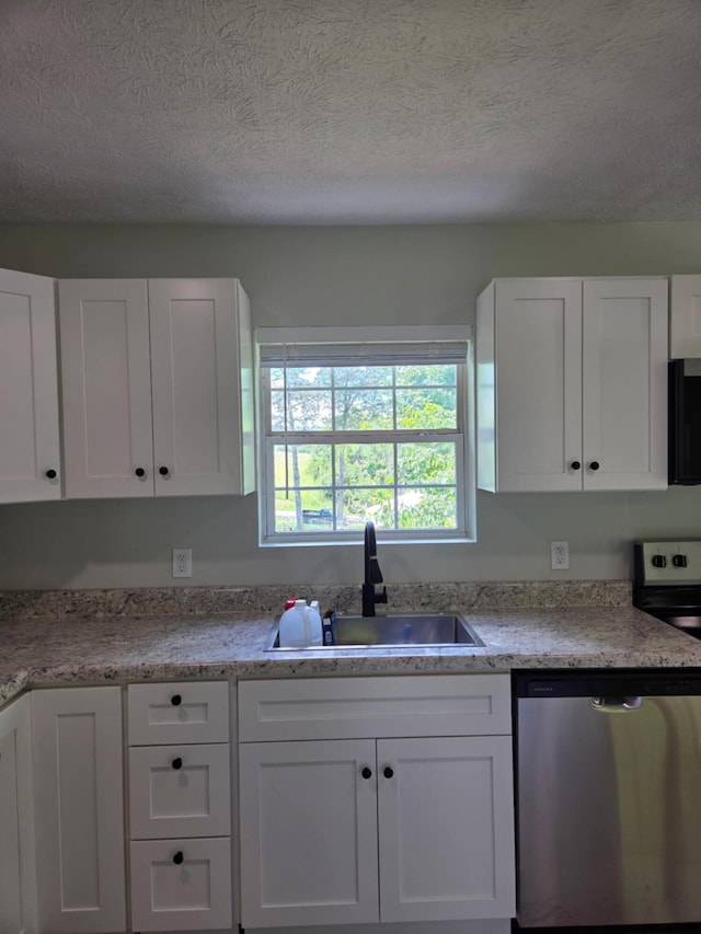 1705 Lester Rd, Tazewell, TN 37879 - kitchen featuring stainless steel appliances, a sink, white cabinetry, and a textured ceiling