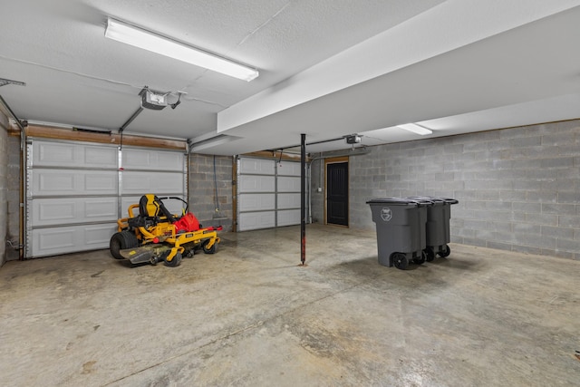 6625 Lainey Jane Ct, Whitesburg, TN 37891 - garage featuring a garage door opener and concrete block wall